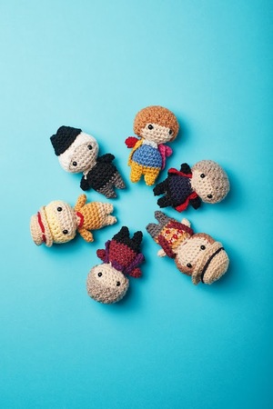 Various crochet drs arranged in a circle