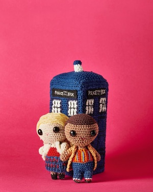 A crochet fifteenth dr and ruby in front of the tardis