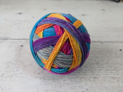 A colorful hand dyed ball of yarn
